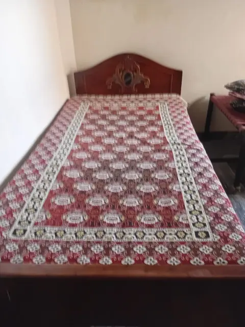 Wooden bed with headboard