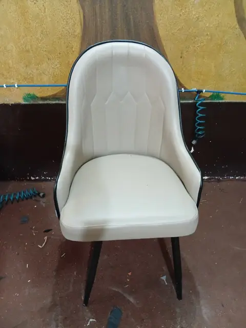 Dining chair upholstered in white leatherette