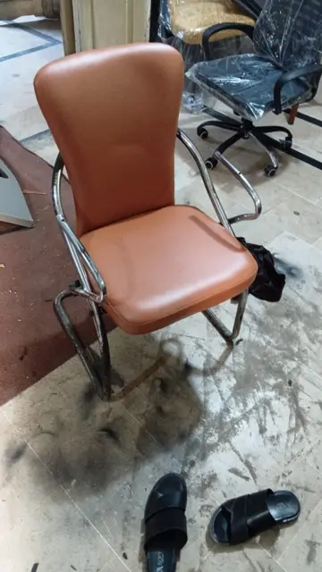 Tan leather chair upholstered