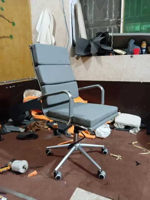 Grey office chair repaired