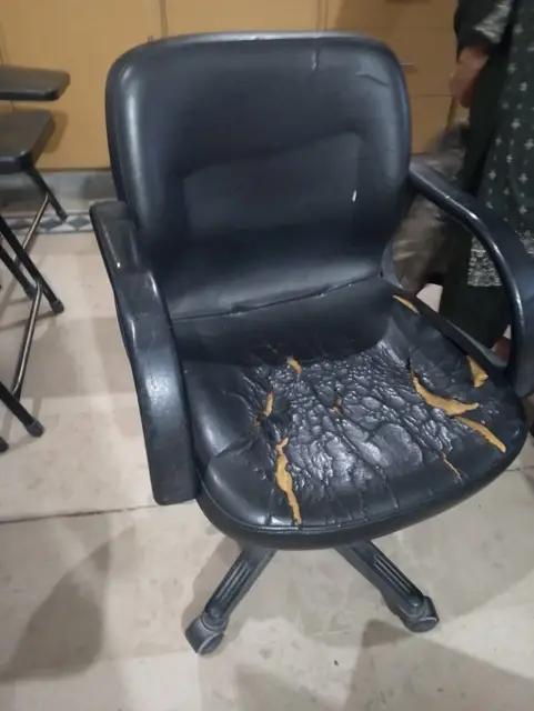 Office chair with peeling leather